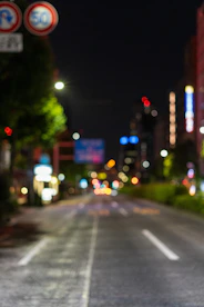 a blurry photo of a city street at night