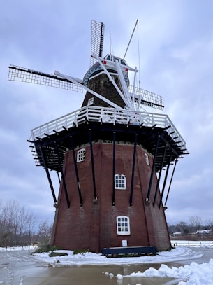 a red brick building with a windmill on top of it
