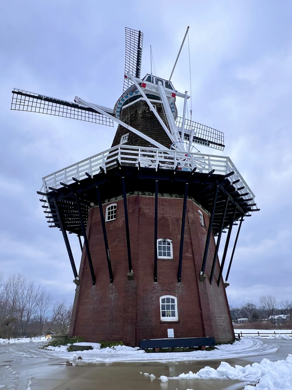 a red brick building with a windmill on top of it