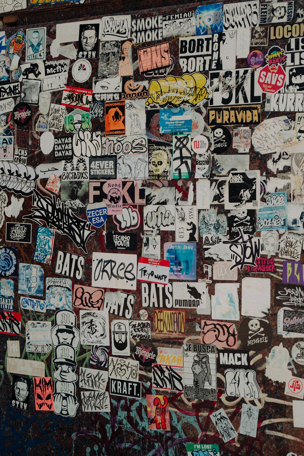 a wall covered in lots of different stickers