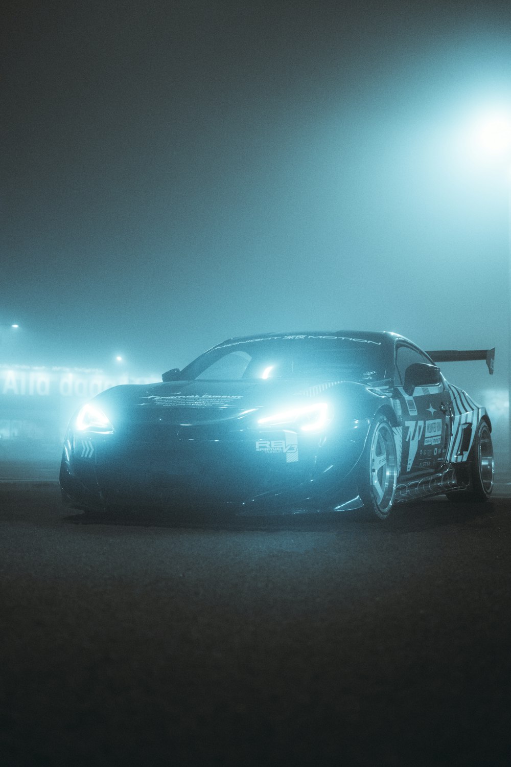 a car parked in a parking lot at night