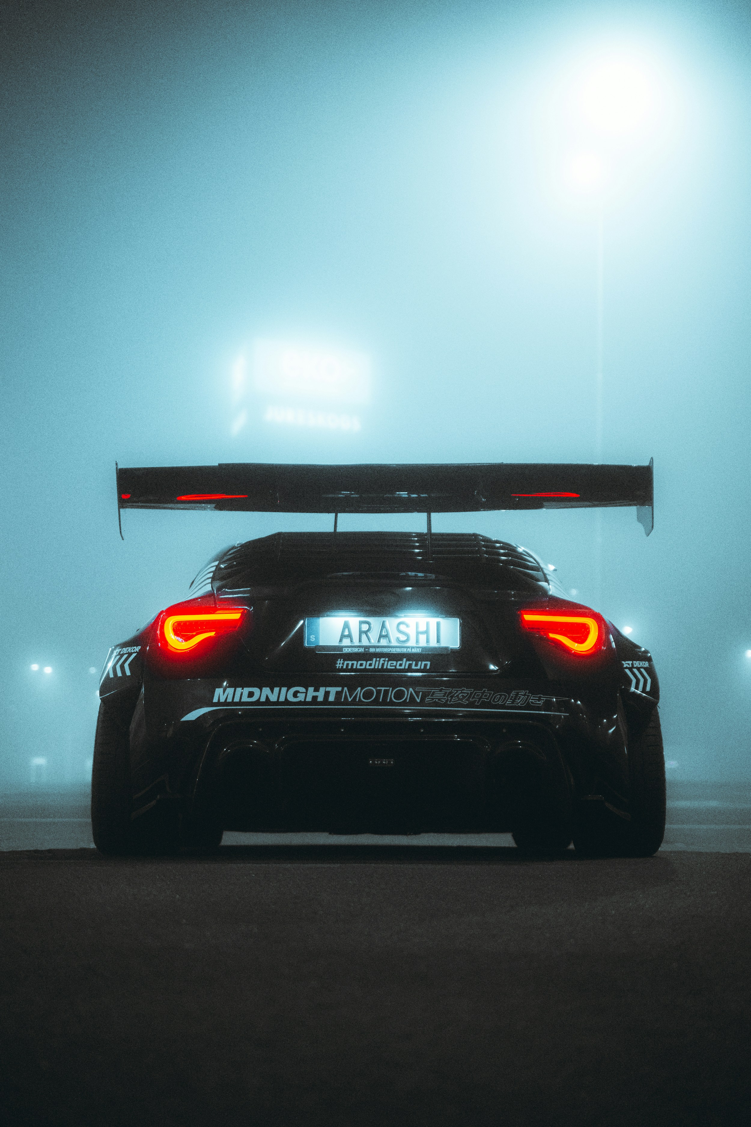 Performance car in a neon garage
