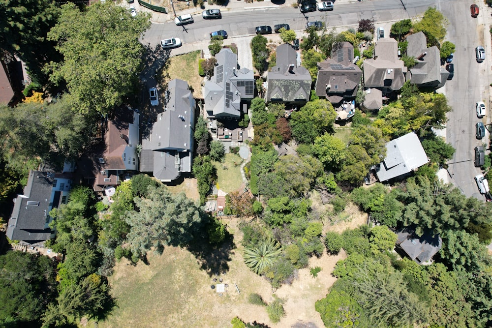 an aerial view of a neighborhood with lots of trees