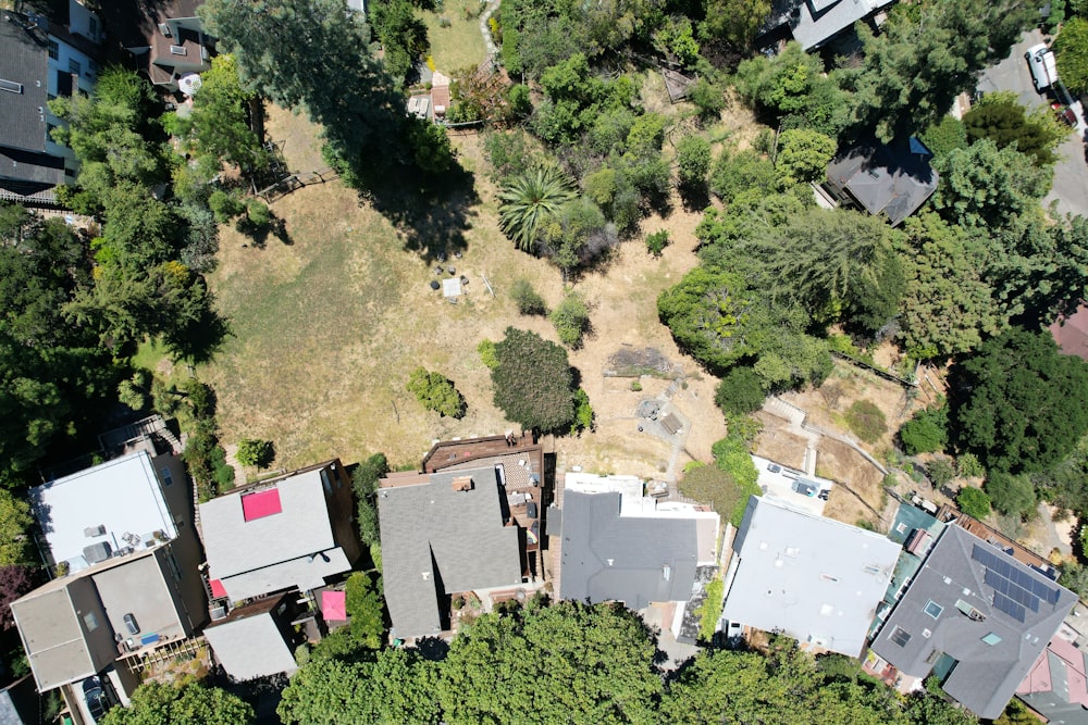 an aerial view of a house surrounded by trees