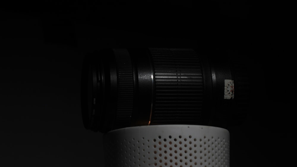 a close up of a camera lens in the dark