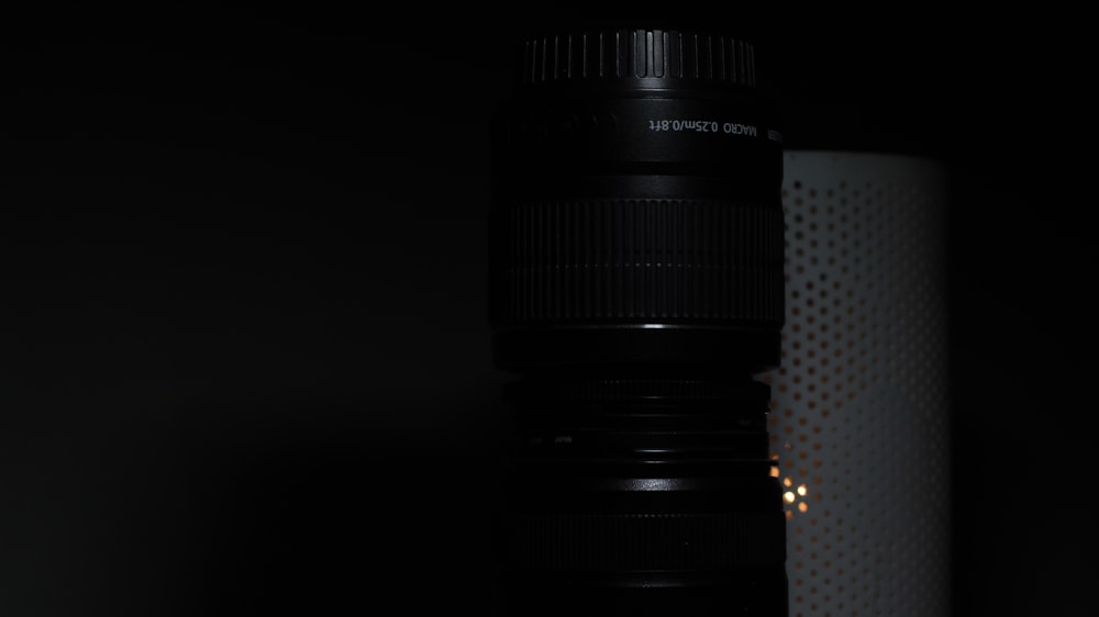 a close up of a camera lens in the dark