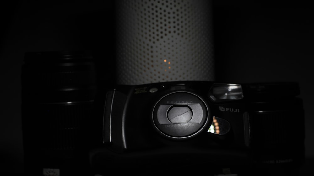 a camera sitting on top of a table in the dark