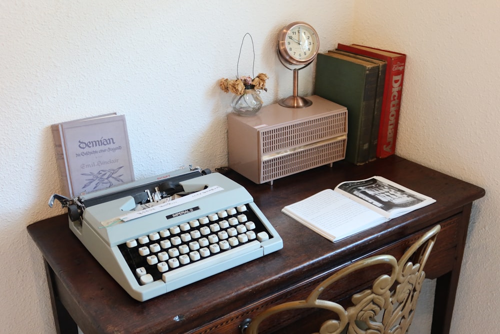an old fashioned typewriter sitting on a desk