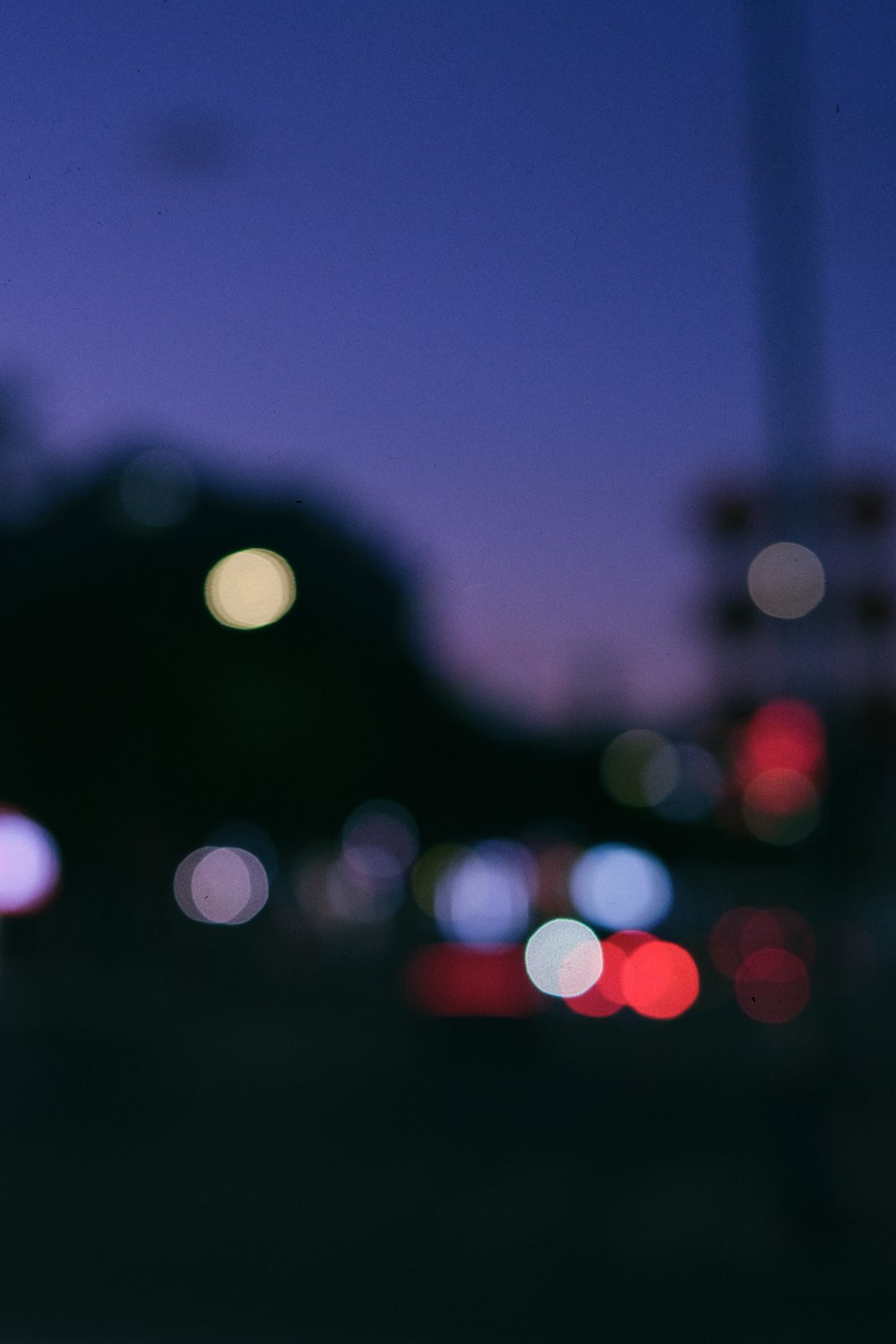 a blurry photo of a city street at night