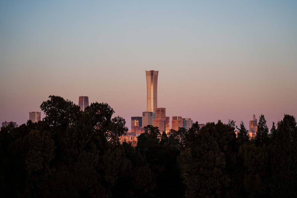 a view of a city with tall buildings and trees