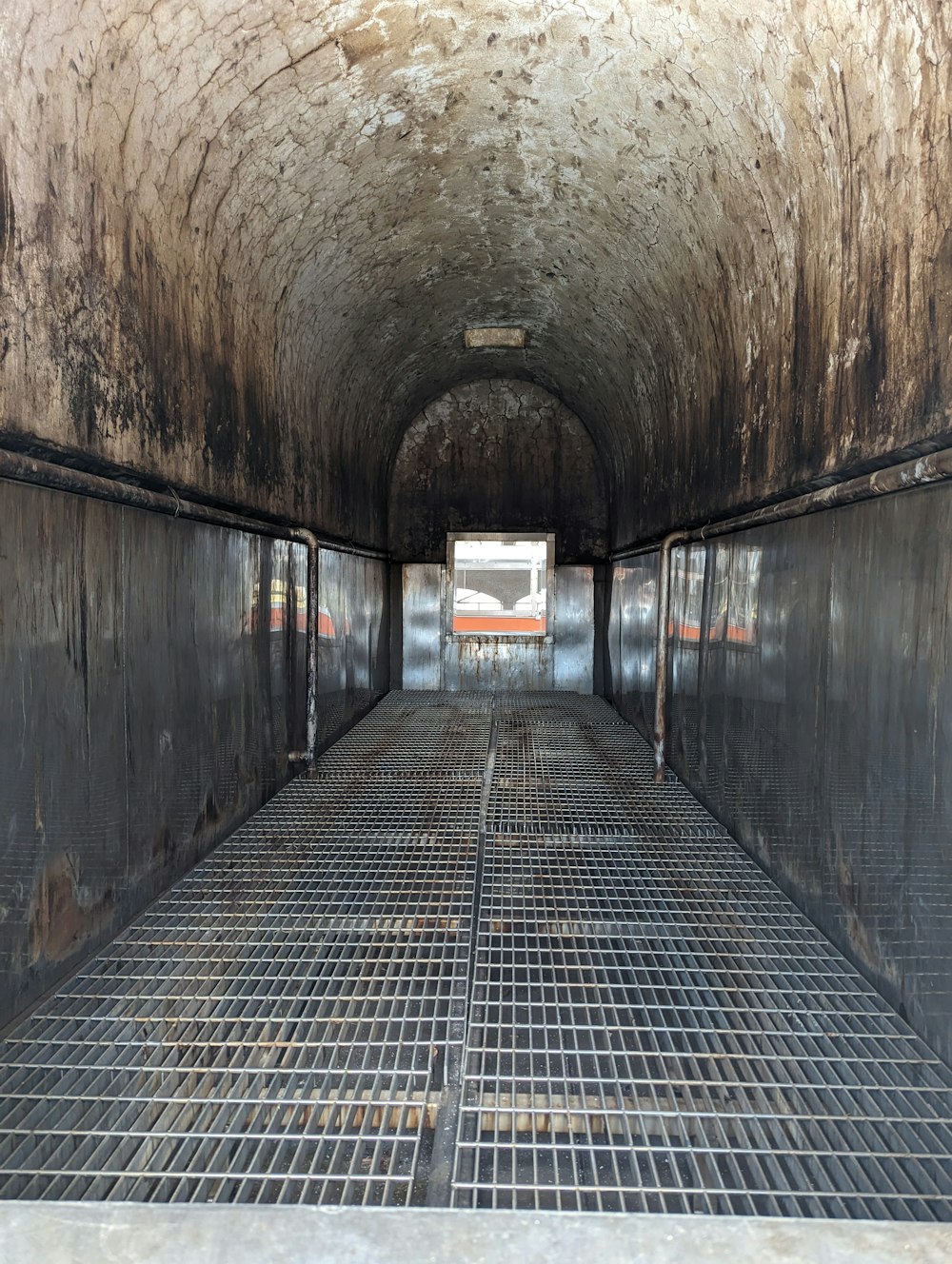 the inside of a truck with metal grates on the floor