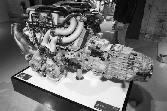 a black and white photo of an engine on display