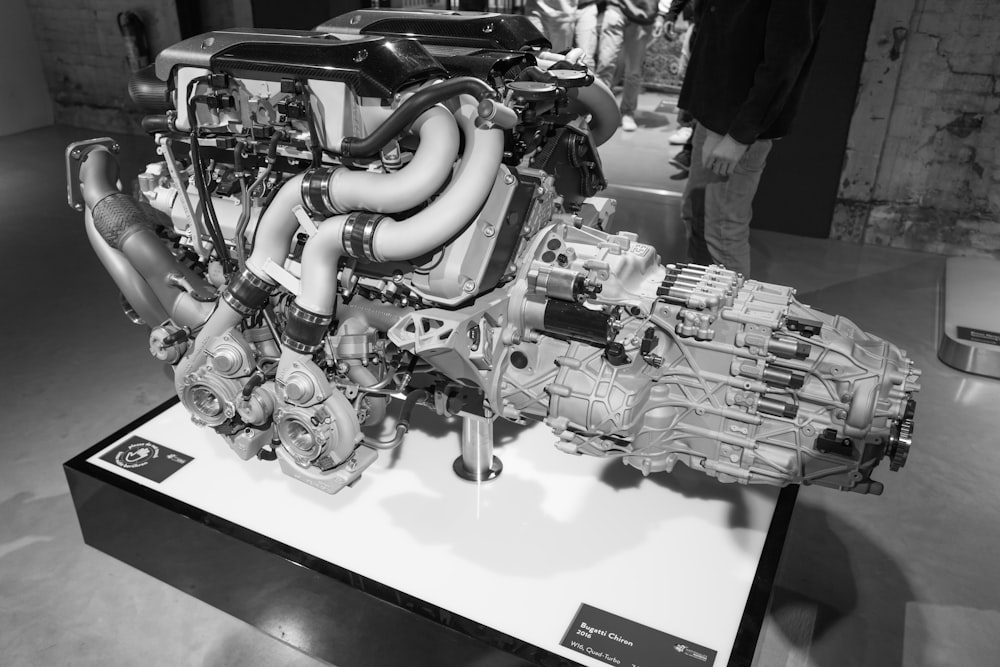 a black and white photo of an engine on display