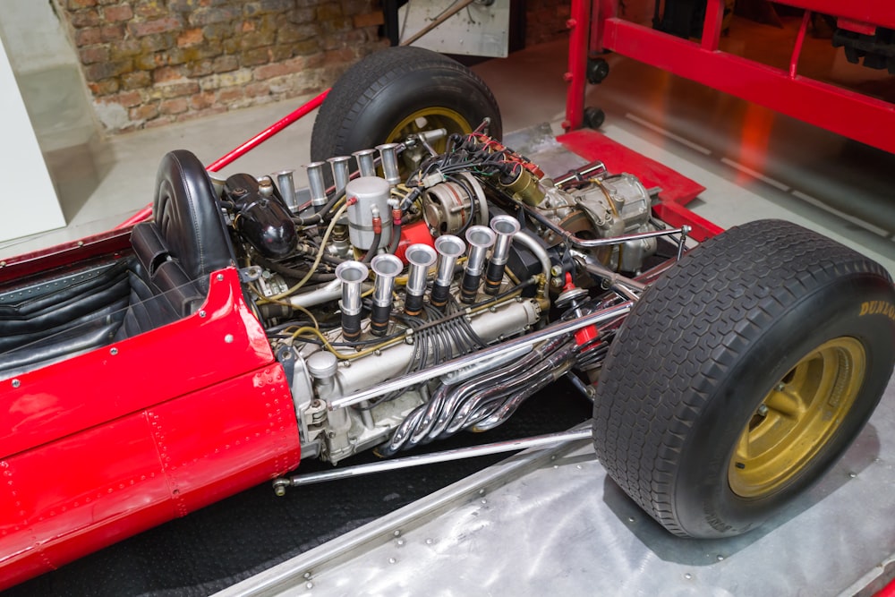 a red race car with a large engine