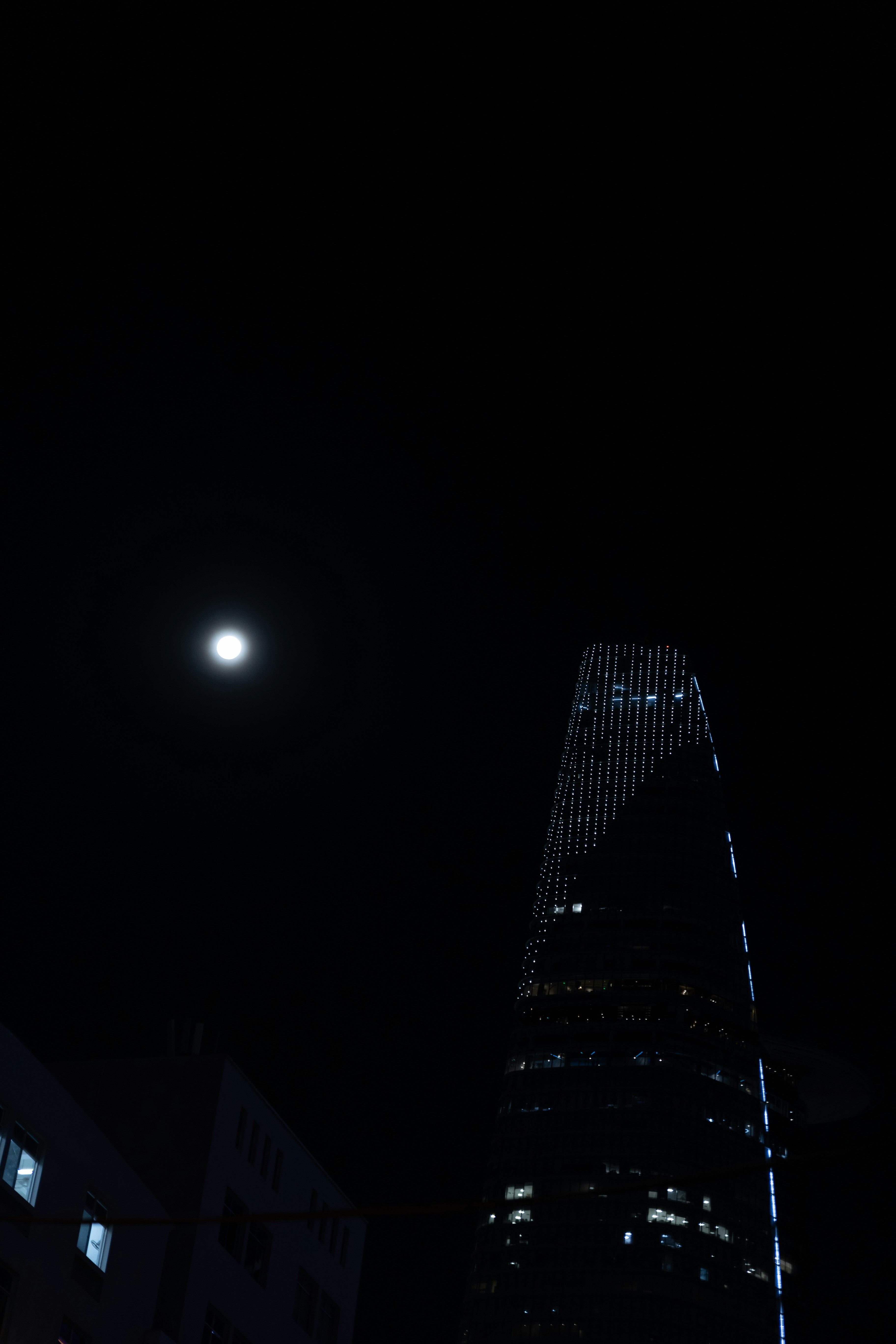a very tall building lit up at night