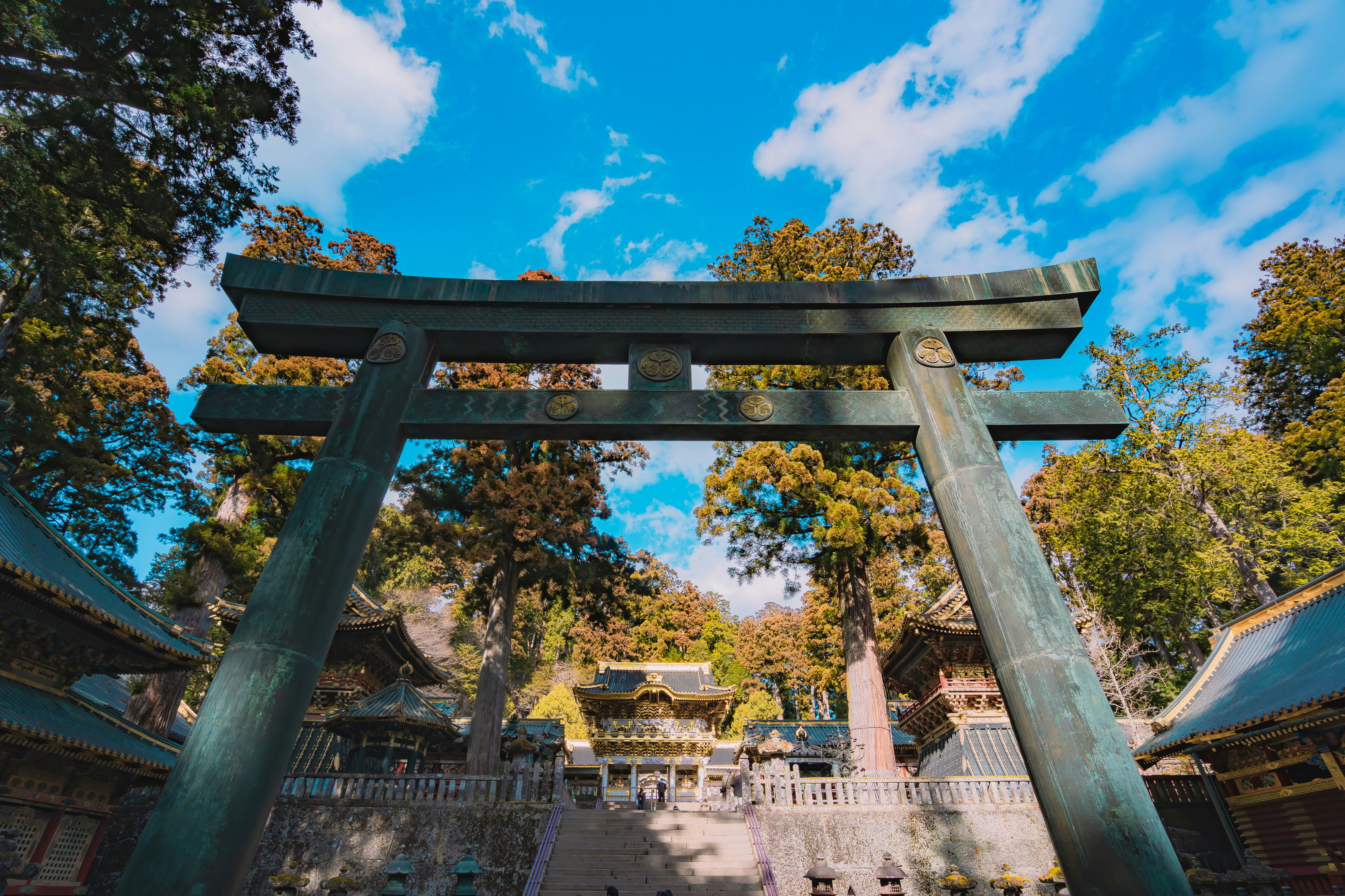 a very tall wooden structure with a sky background, Main torii for the Toshogu shrine of Nikko in January