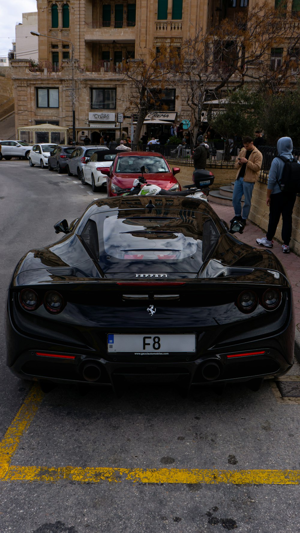 a black sports car parked on the side of the road