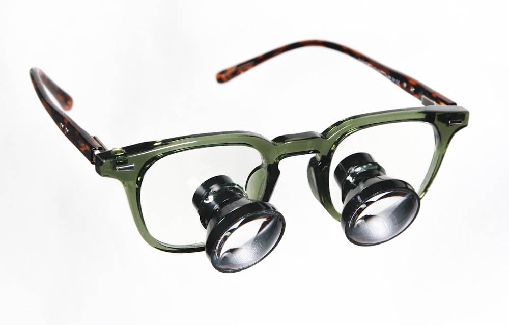 a pair of glasses with a pair of reading glasses on top of it