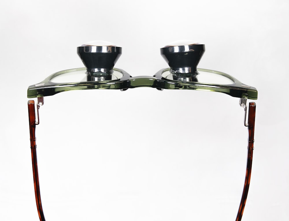 a pair of glasses sitting on top of a table