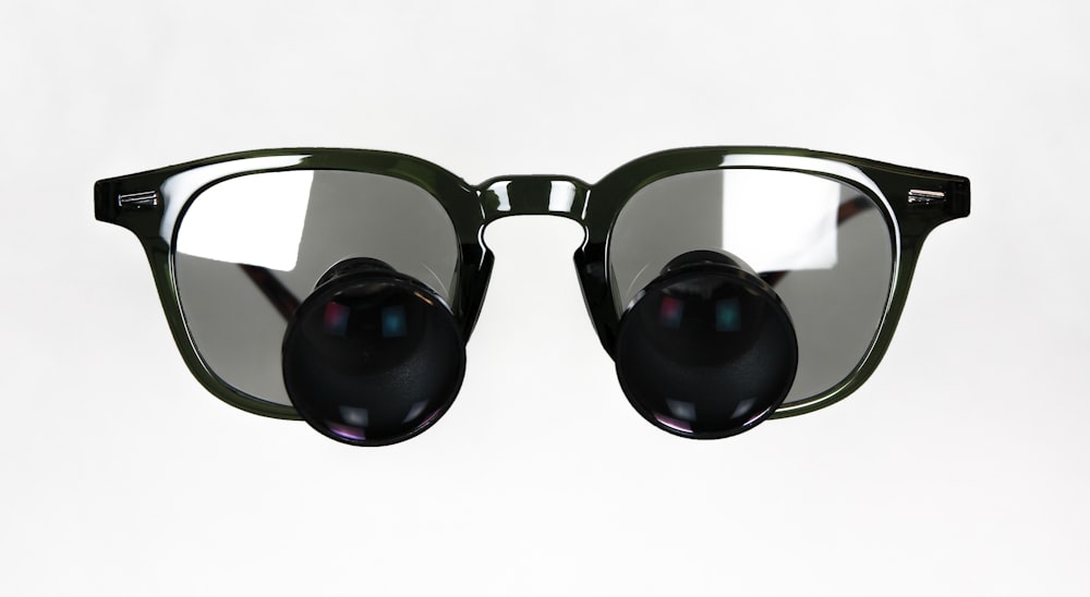 a pair of sunglasses with a black lens