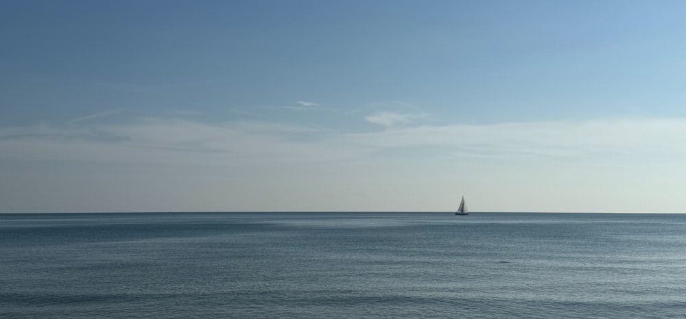 a sailboat is out on the open water