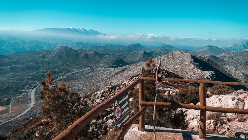 a view of a mountain range from the top of a hill