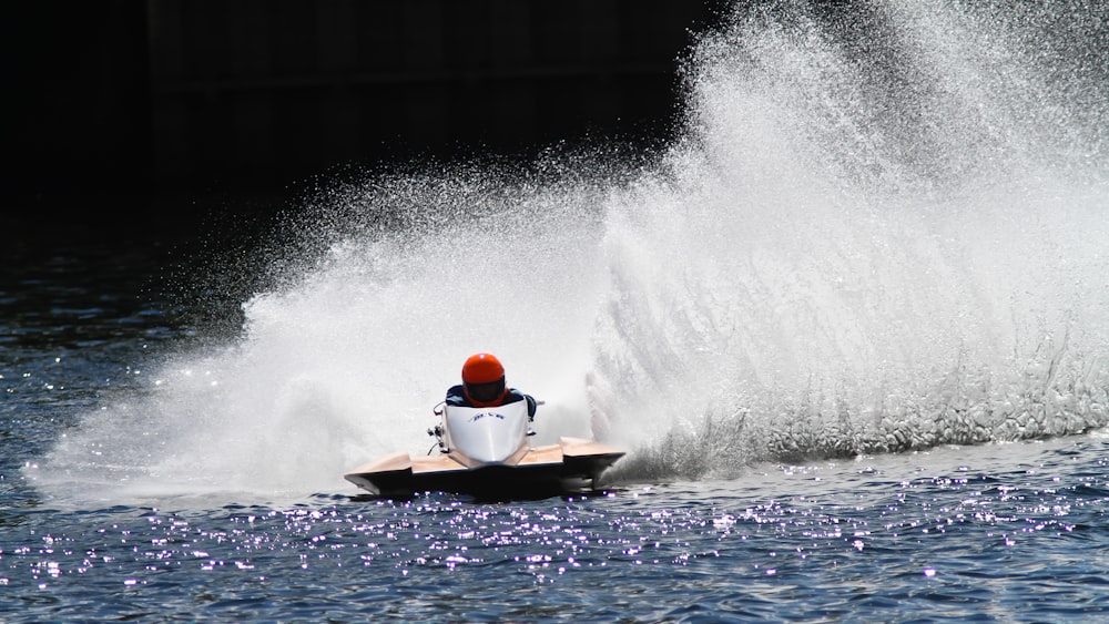 a person riding a jet ski on a body of water