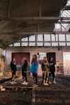 a group of people standing in a train station
