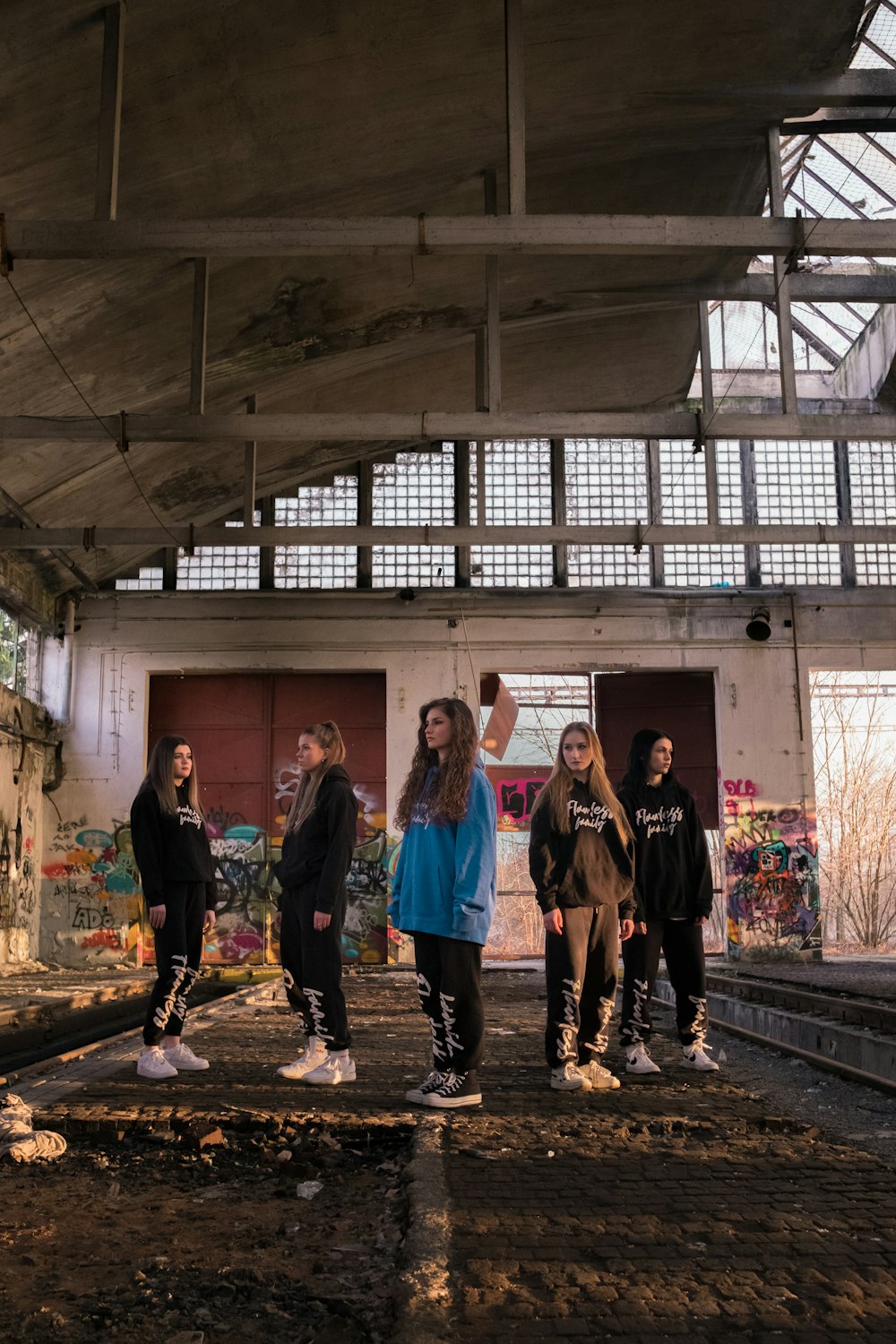 a group of people standing in a train station