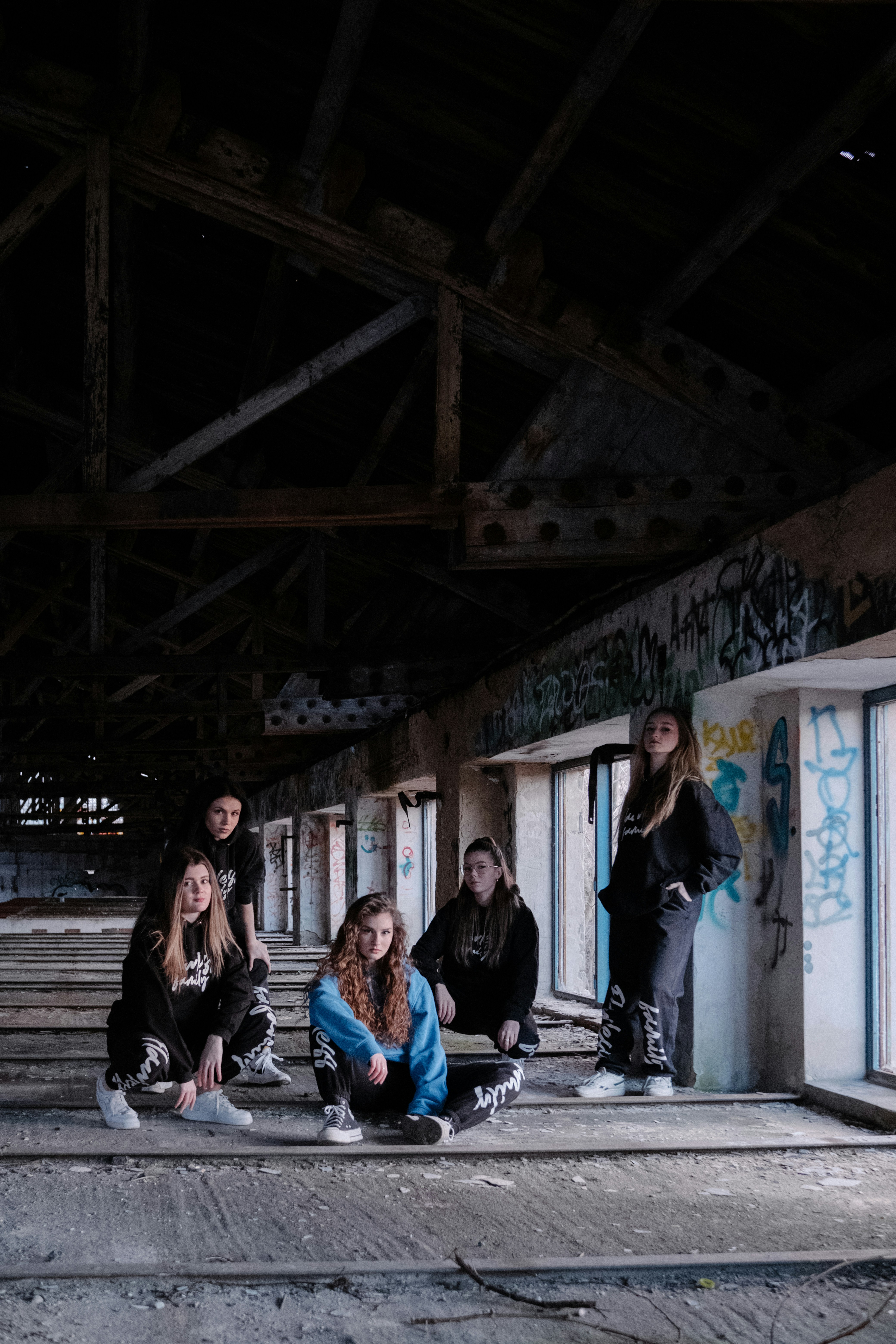 a group of young people sitting on the ground