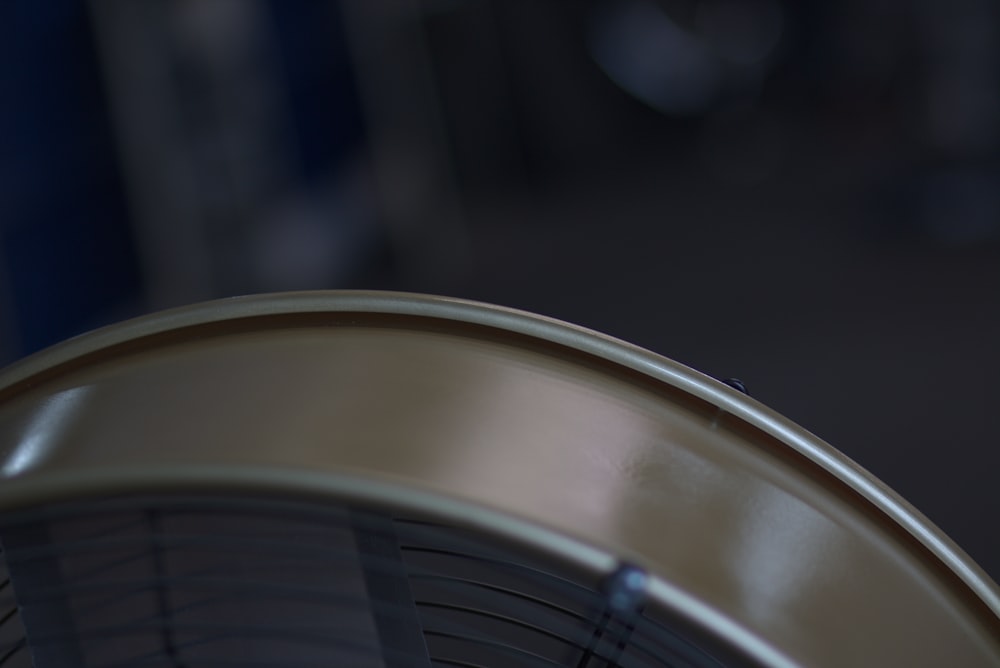 a close up of a metal object with a blurry background