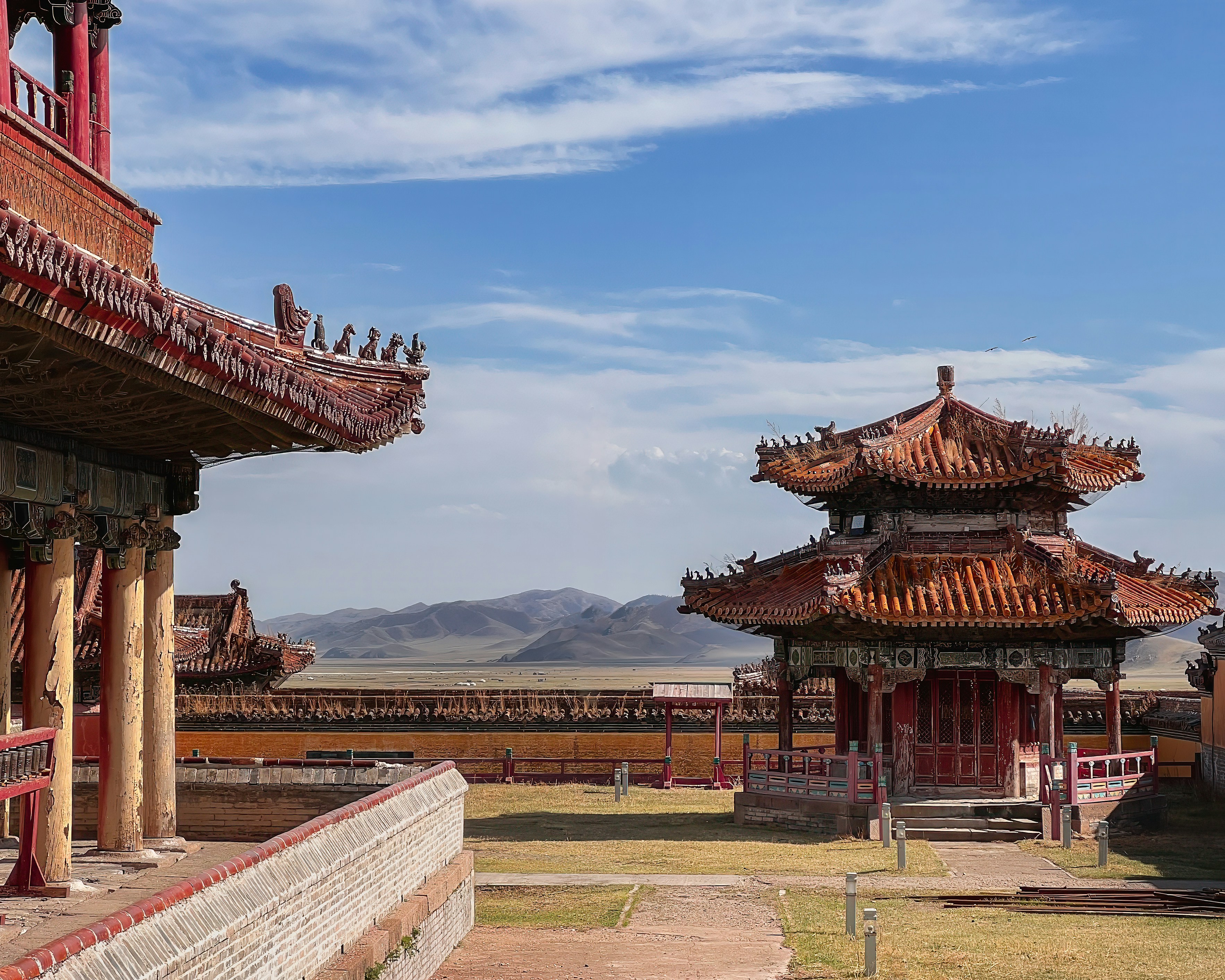 a red and white building with a sky background