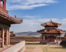 a red and white building with a sky background