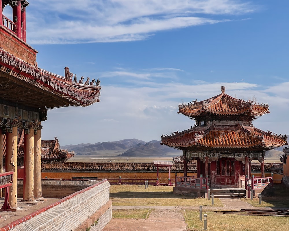 a red and white building with a sky background