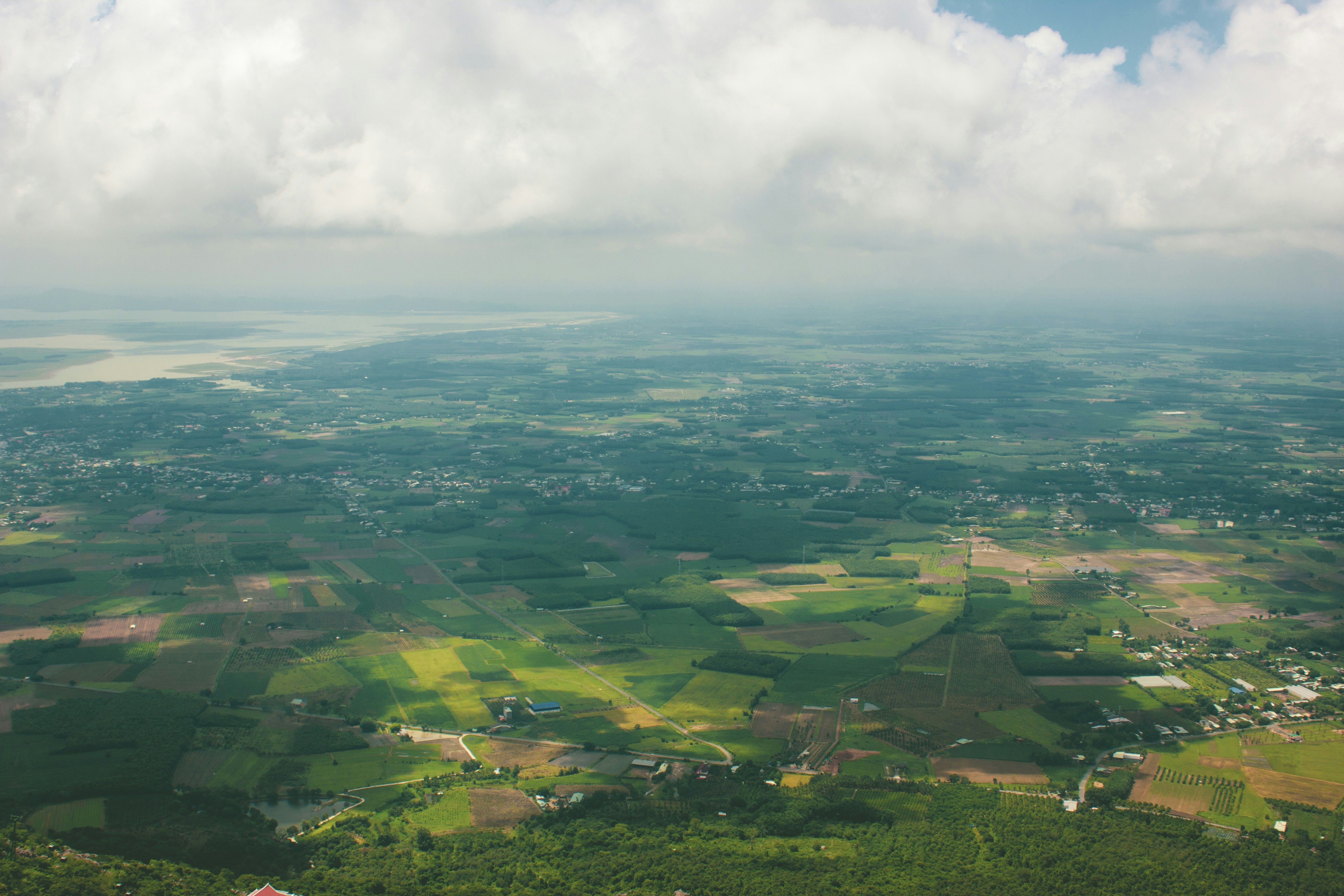 an aerial view of a rural area with green fields