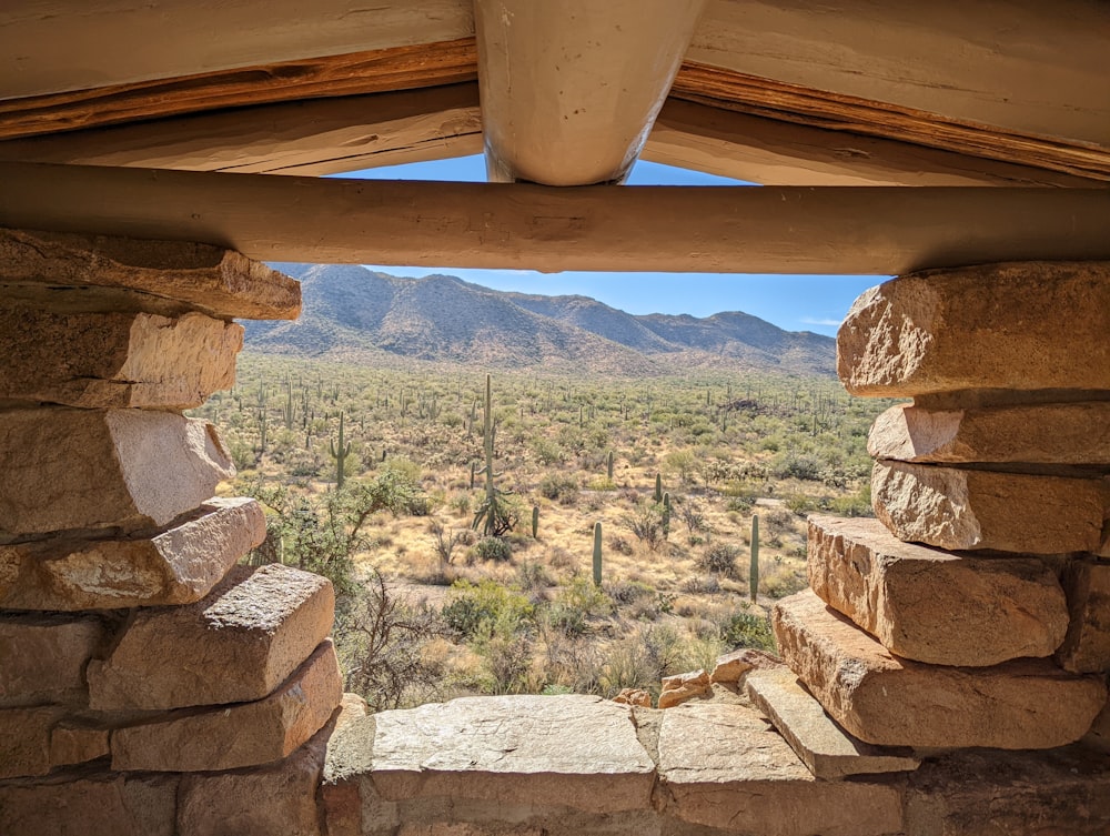 a view of the desert from a window in a building