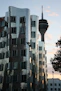 a tall building with a tower in the background