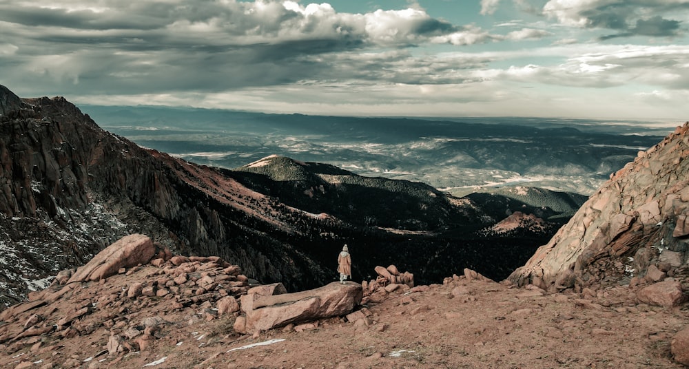 a person standing on top of a mountain