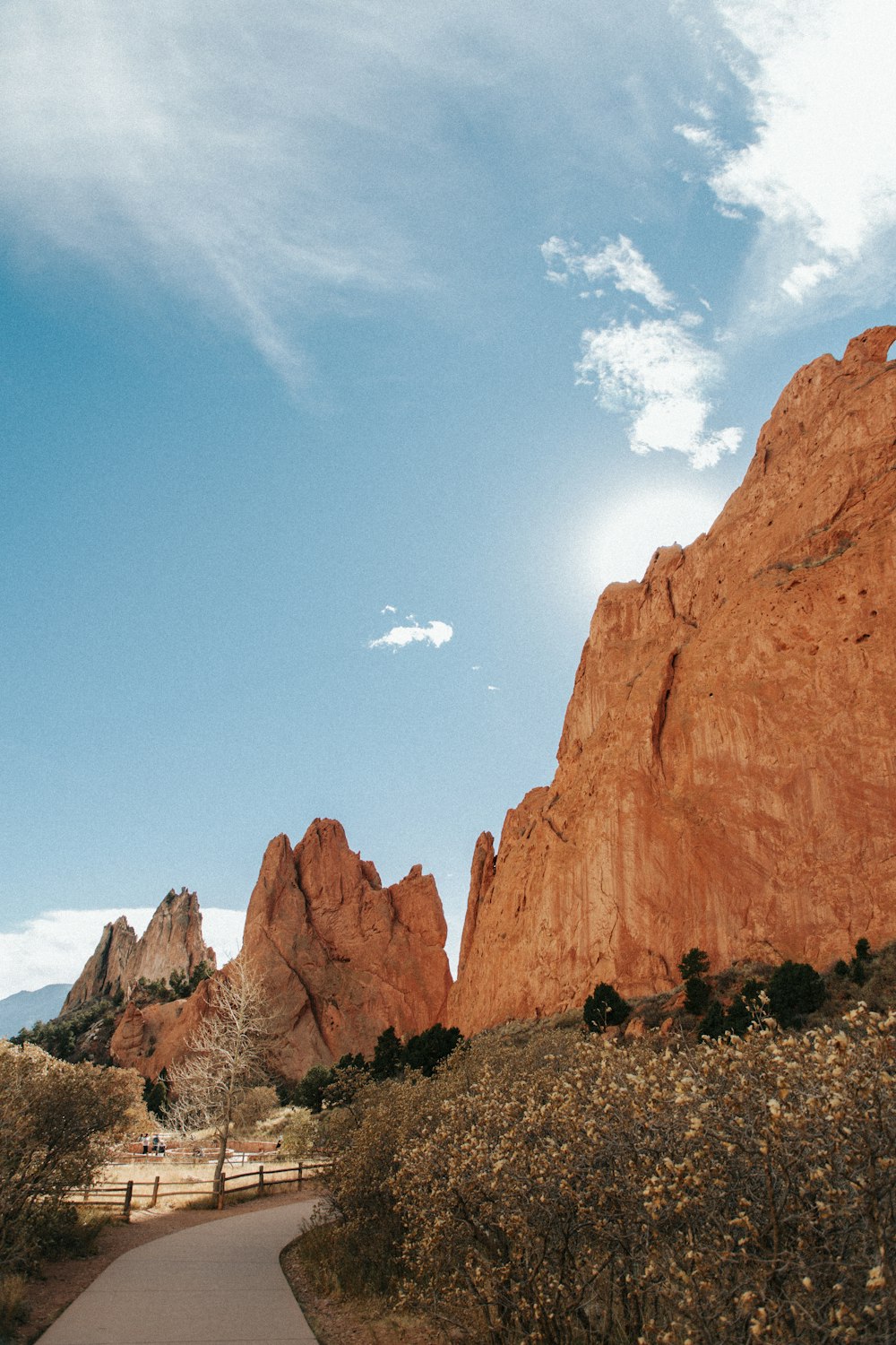 a path leading to a large rock formation