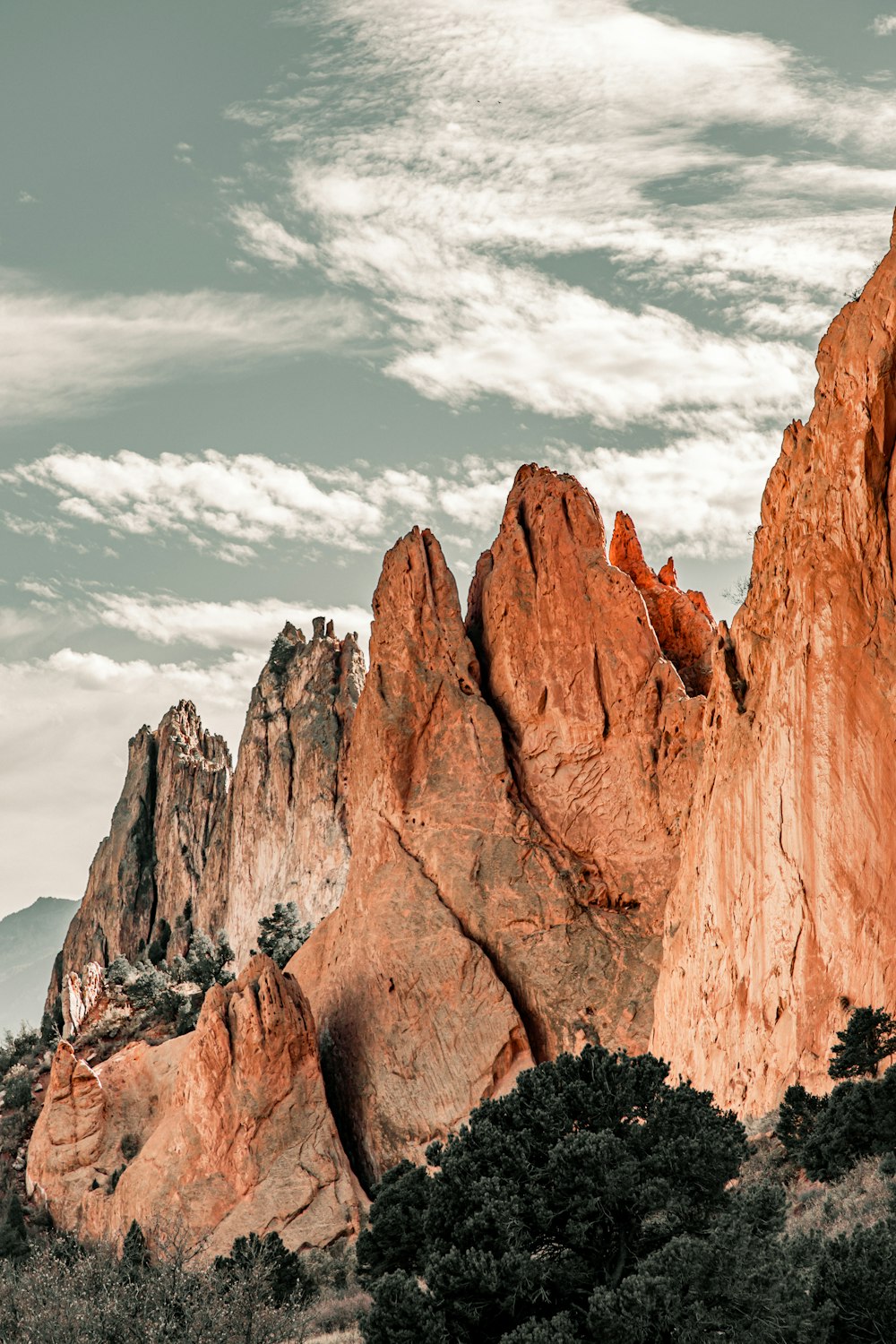 a group of mountains with a sky background