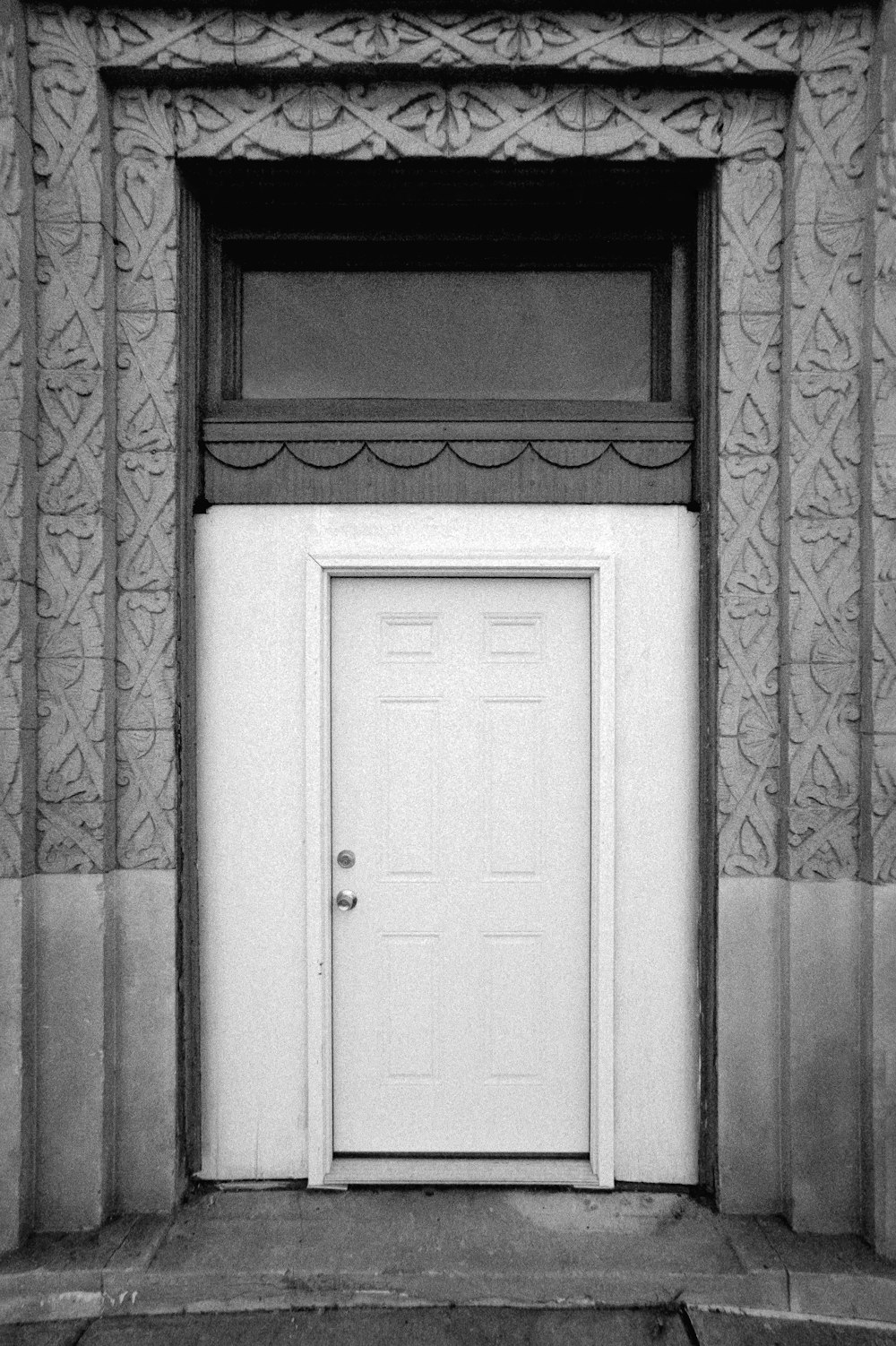 a black and white photo of a door