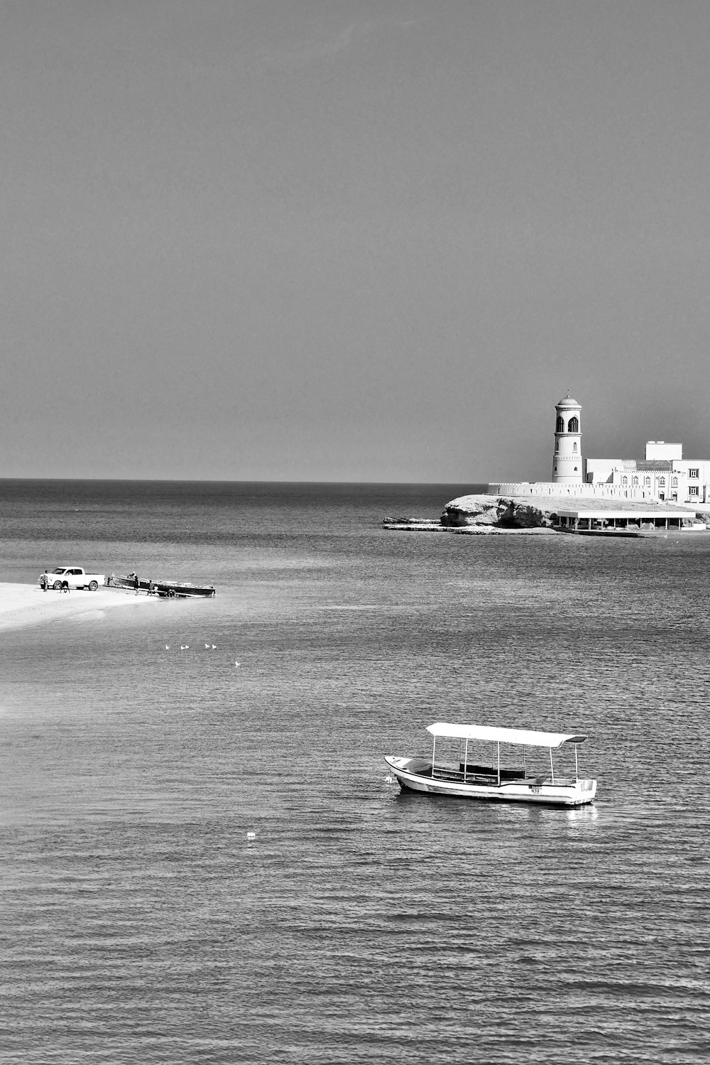 a boat floating on top of a large body of water