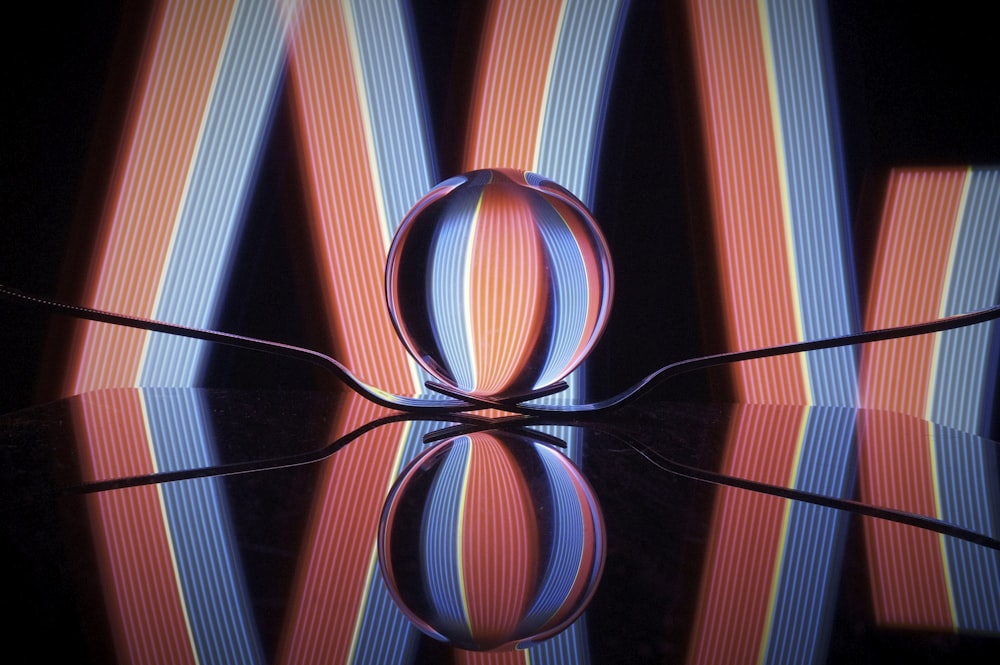 a reflection of a pair of scissors on a surface