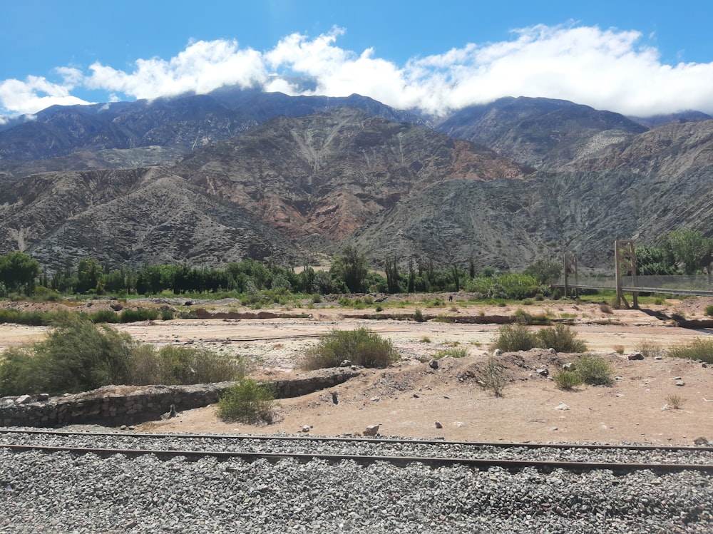 a view of a mountain range from a train