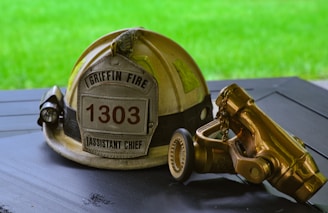 a fireman's helmet sitting on top of a table
