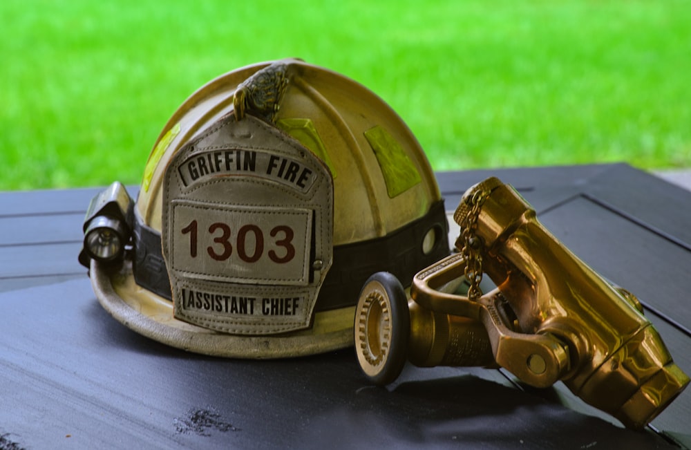 a fireman's helmet sitting on top of a table