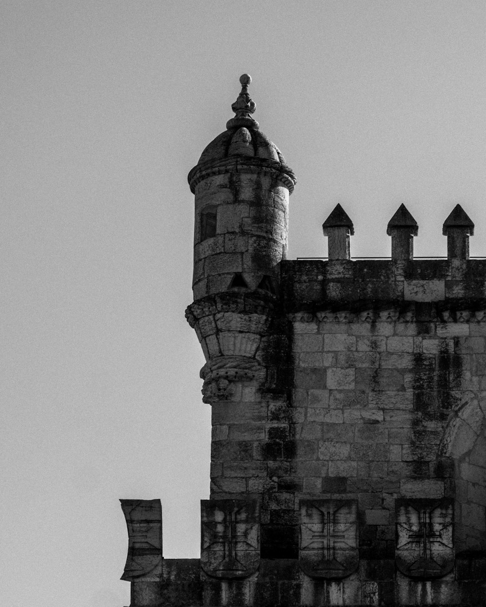 a black and white photo of a clock tower