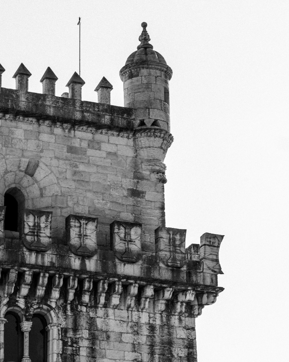 a black and white photo of a clock tower