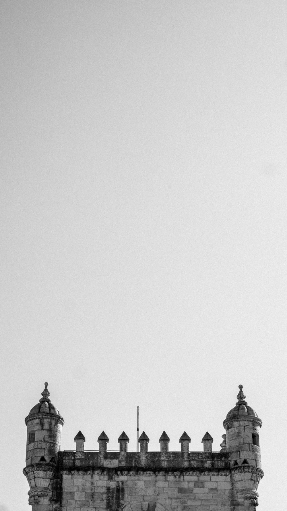 a black and white photo of a clock tower