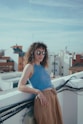 a woman standing on top of a roof